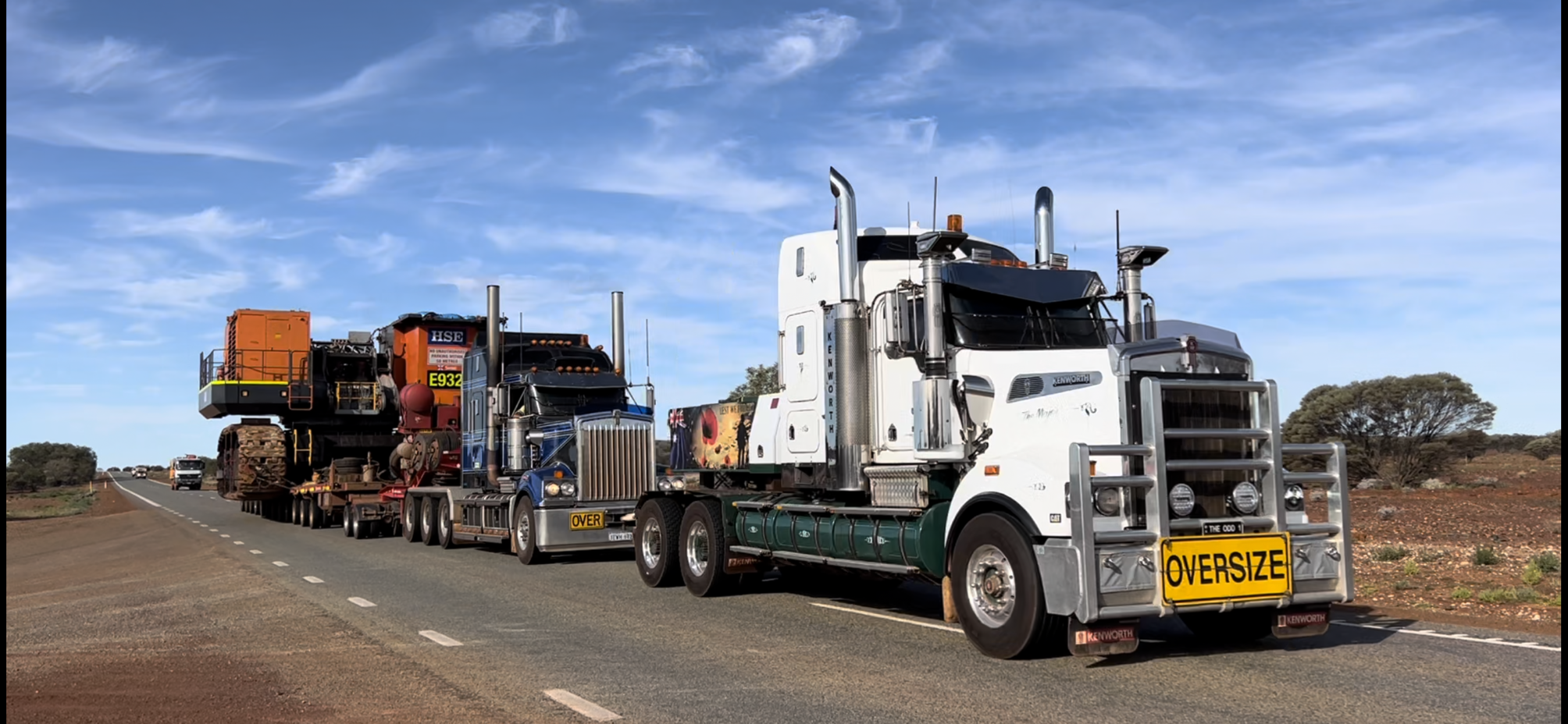 Oversize heavy vehicle with a load moving along the road